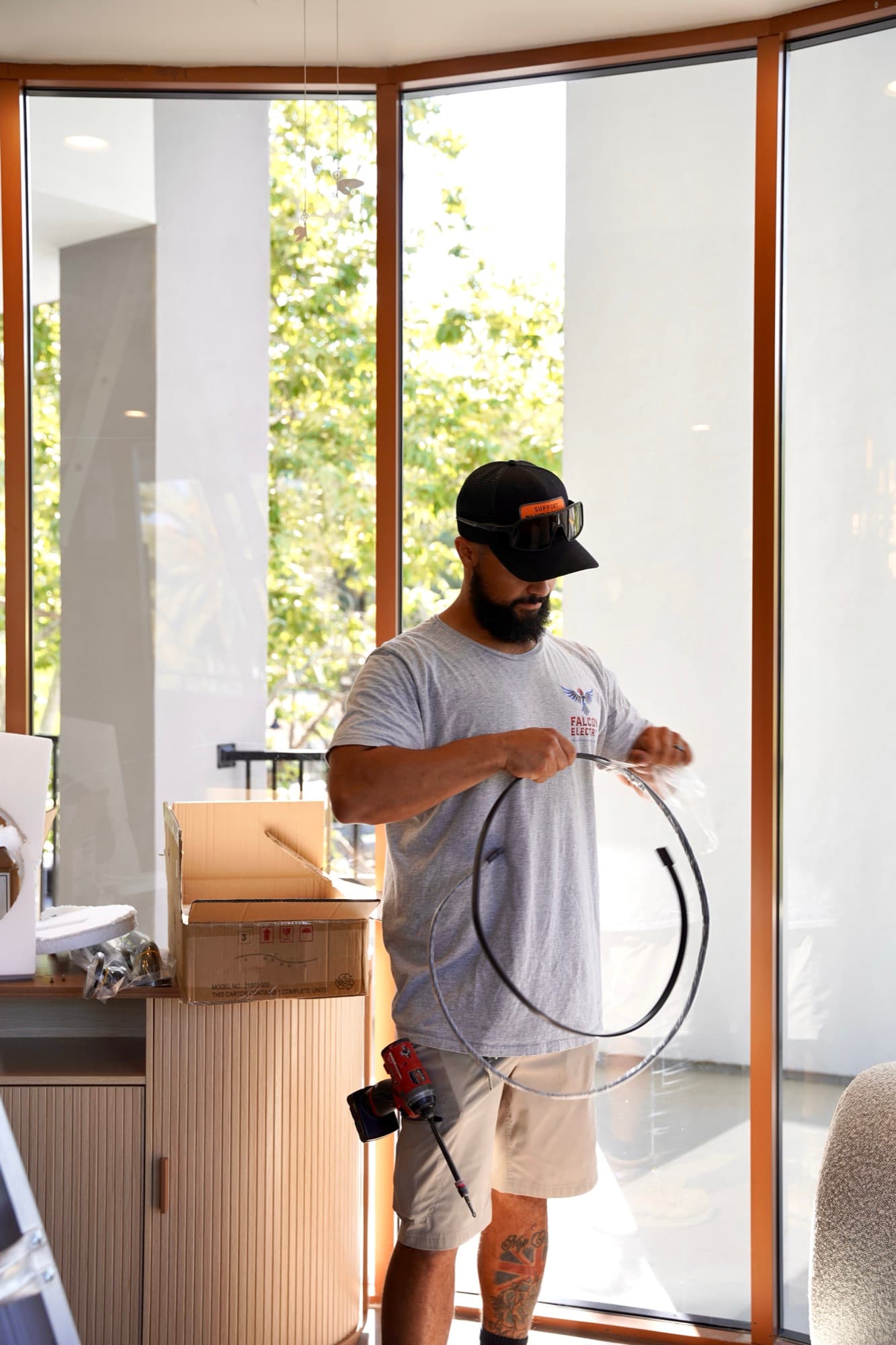 Ean Orchard handling a coil of wire on-site